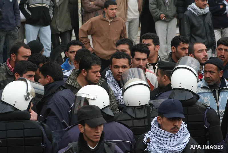 Palestinians attend a protest to demand jobs in the Palestinian Authority, in Gaza. Palestinian leaders struck discordant notes on how to deal with Israel on Saturday as parliament met to usher in a unity government inte...