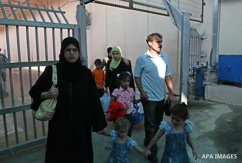 Palestinians leave Gaza through the Erez crossing in the northern Gaza strip. Hundreds of Palestinians left through the northern Erez crossing on their way to Egypt after Israeli authorities granted permission to those h...