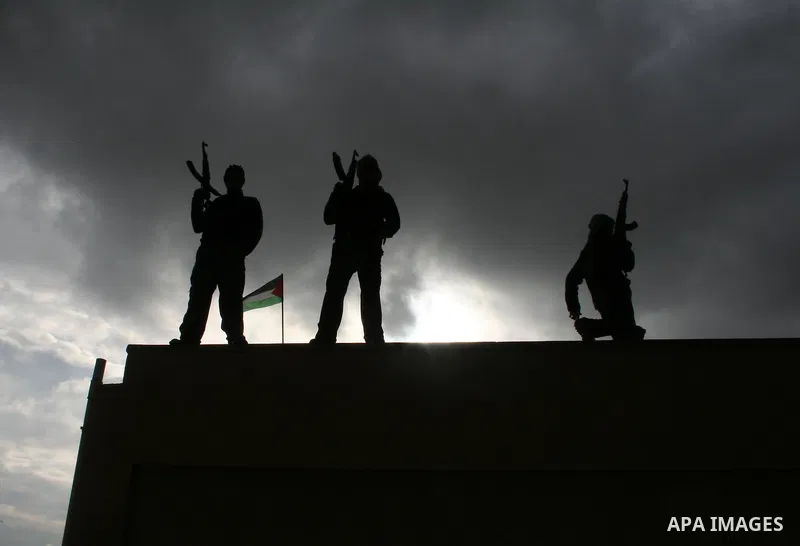 Palestinian Fatah militants, loyal to their leader Mahmud Abbas, participate in a rally in Gaza City to celebrate 42 years since the party's founding. Abbas dug in his heels in a standoff with the ruling Hamas movement t...