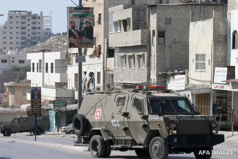 Israeli soldiers are seen during an Israeli army operation in the Al Ain refugee camp of the West Bank city of Nablus. Israeli troops and Palestinian gunmen traded gunfire during an army raid in the refugee camp Tuesday,...