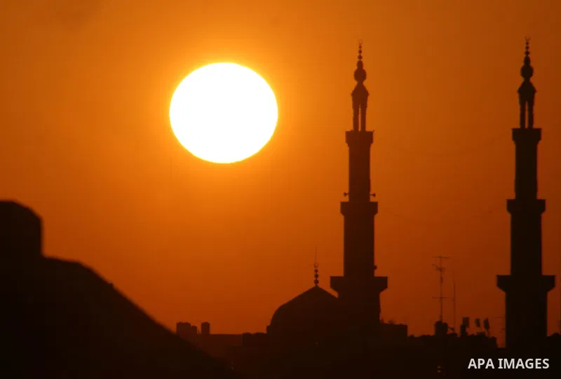 Mosque and the Church in sunset time in Gaza City. Most of the world's 1.2 billion Muslims began Ramadan today, a holy month of dawn-to-dusk fasting, festivities and abstinence. The start of Ramadan, the ninth and holies...