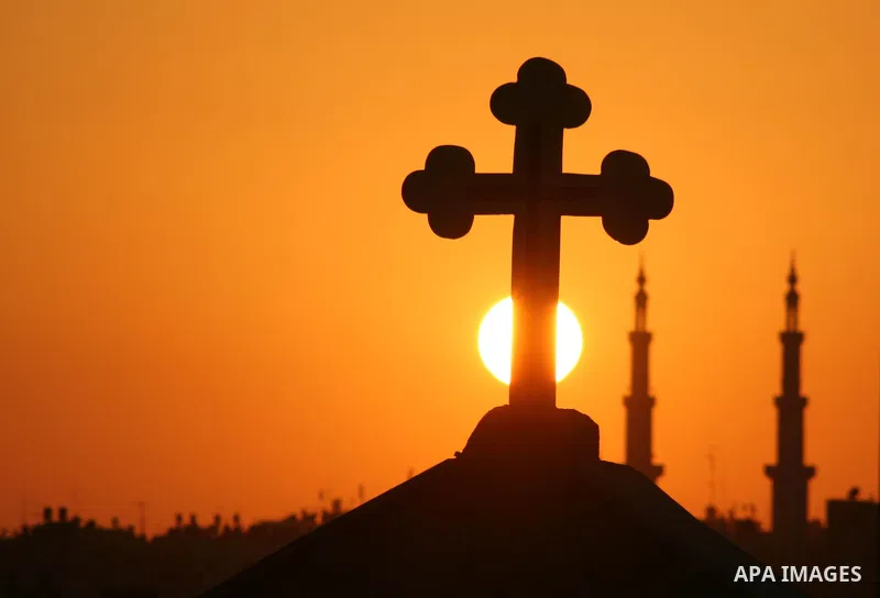 Mosque and the Church in sunset time in Gaza City. Most of the world's 1.2 billion Muslims began Ramadan today, a holy month of dawn-to-dusk fasting, festivities and abstinence. The start of Ramadan, the ninth and holies...