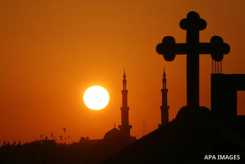 Mosque and the Church in sunset time in Gaza City. Most of the world's 1.2 billion Muslims began Ramadan today, a holy month of dawn-to-dusk fasting, festivities and abstinence. The start of Ramadan, the ninth and holies...