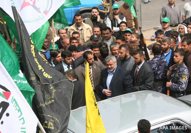 Palestinian Prime Minister Ismail Haniyeh attends a gathering to the relatives of prisoners during a protest calling for the release of Palestinian prisoners from Israeli jails, in front of the red cross headquarters in...