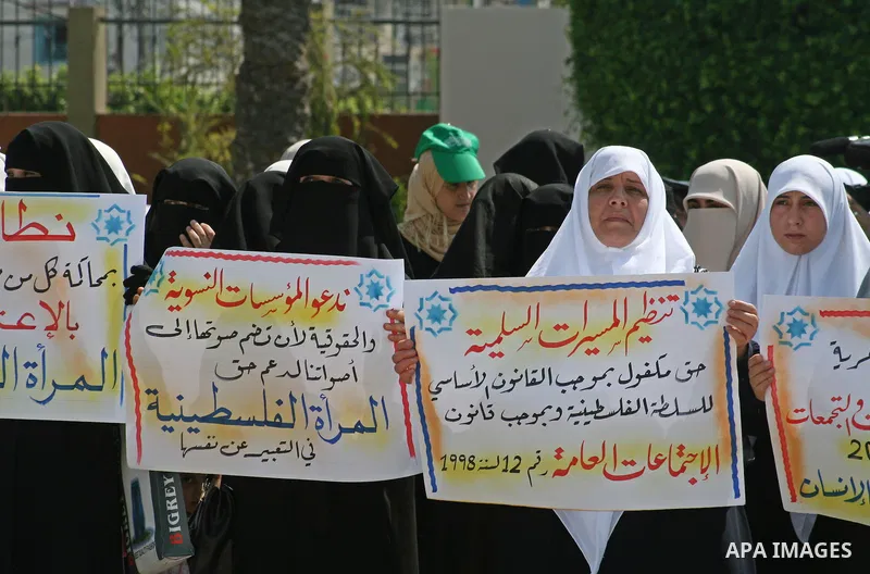 Palestinian women supporters of the Hamas movement gather during a demonstration in front of the legislative council in Gaza City. Palestinian women demanding to halt the palestinian authority forces's violences against...
