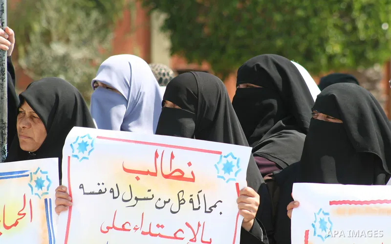 Palestinian women supporters of the Hamas movement gather during a demonstration in front of the legislative council in Gaza City. Palestinian women demanding to halt the palestinian authority forces's violences against...