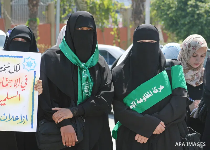 Palestinian women supporters of the Hamas movement gather during a demonstration in front of the legislative council in Gaza City. Palestinian women demanding to halt the palestinian authority forces's violences against...