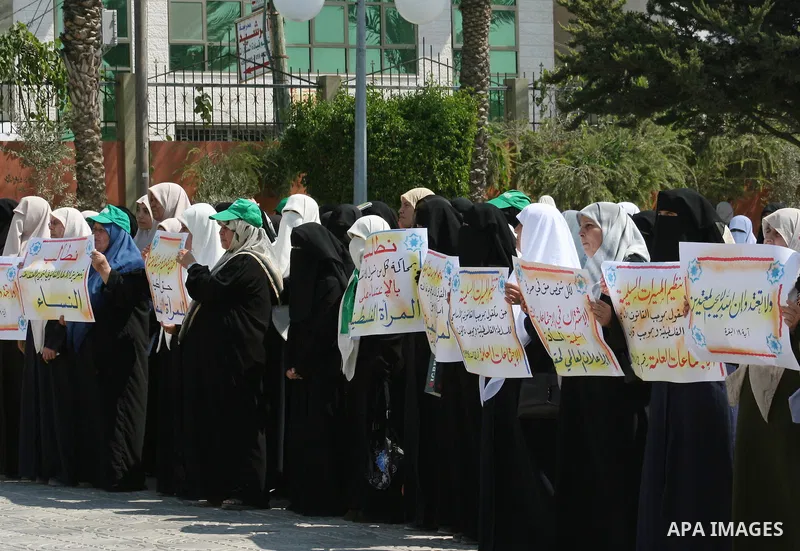 Palestinian women supporters of the Hamas movement gather during a demonstration in front of the legislative council in Gaza City. Palestinian women demanding to halt the palestinian authority forces's violences against...