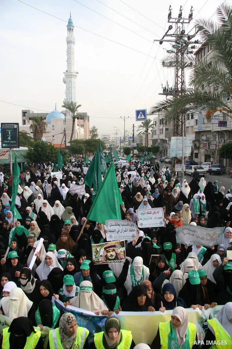 Palestinian women, supporters of Hamas Islamist movement, attend a protest in Gaza City against what the Islamists say is the arrest of hundreds of its members by Palestinian authorities in the West Bank. Hamas said last...