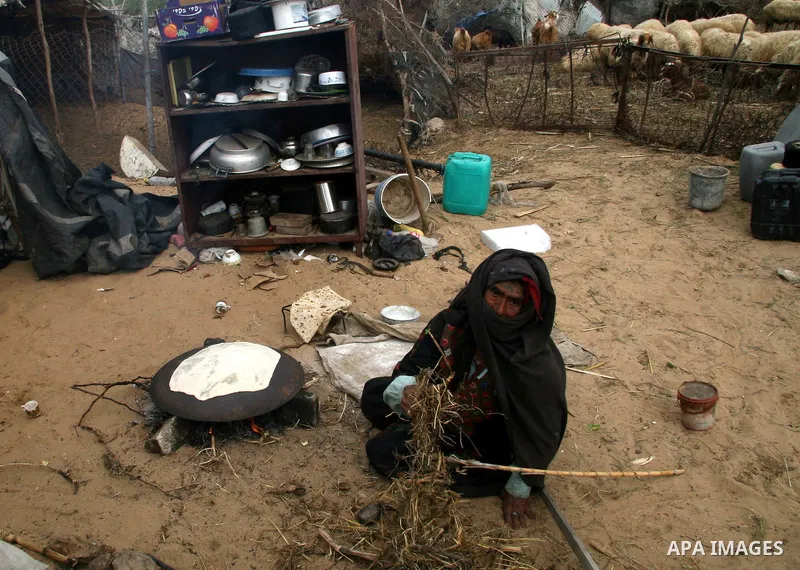 An impoverished Palestinians live amidst rubbish and shacks at a poverty-stricken southern Gaza City neighborhood. The United Nation says more than half of residents in the Gaza Strip are living under the poverty line. L...
