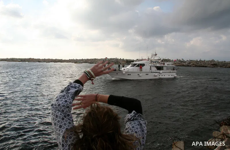 Palestinians receive a boat carrying a group of pro-Palestinian peace activists and European politicians upon its arrival in Gaza City. Israel allowed the "Dignity," a small yacht, to sail to the Gaza Strip in the fourth...