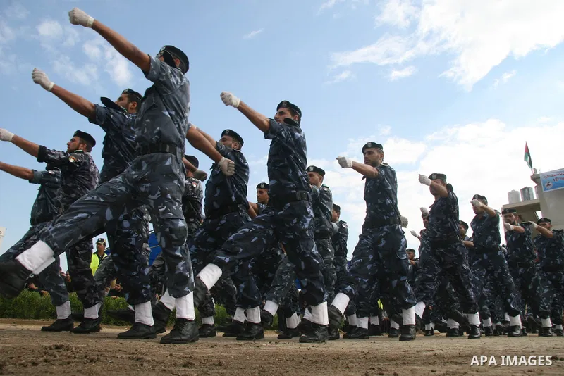 Palestinian police loyal to the Hamas movement take part in a graduation ceremony in Gaza City. The Hamas rulers of the Gaza Strip released 17 member of the rival Fatah movement today in what it called a goodwill gesture...