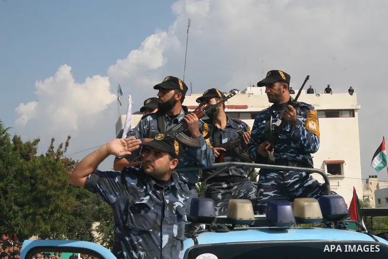 Palestinian police loyal to the Hamas movement take part in a graduation ceremony in Gaza City. The Hamas rulers of the Gaza Strip released 17 member of the rival Fatah movement today in what it called a goodwill gesture...