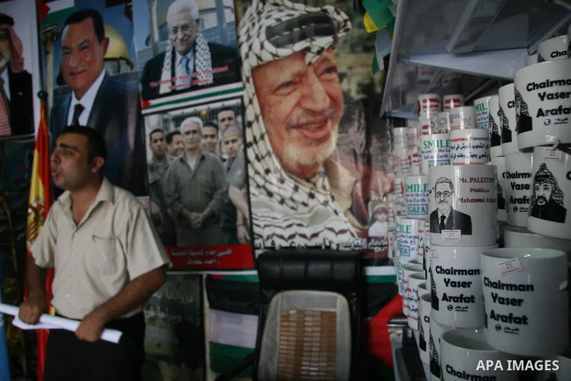 Palestinian vendor display posters of former Hamas Prime Minister Ismail Haneiya and Palestinian President Mahmoud Abbas at a shop in Gaza City. The implementation of an Egyptian plan for reconciliation between the Pales...