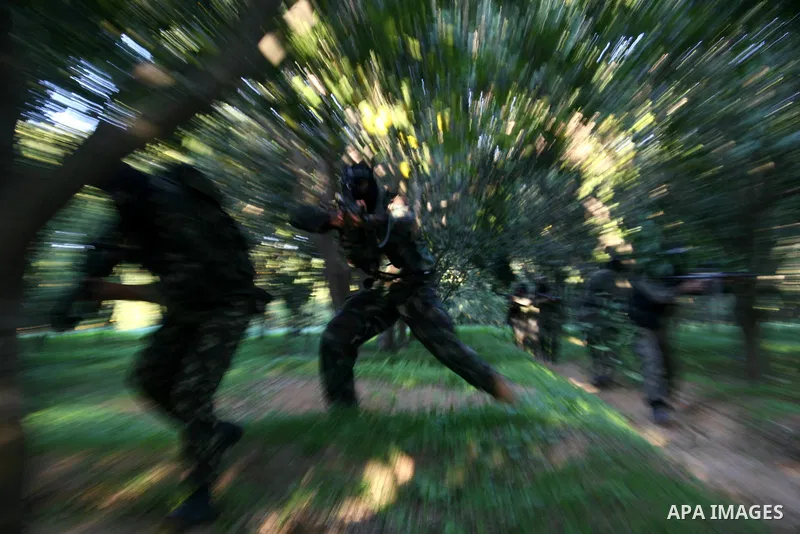 Palestinian militants of the Nasser Salah al-Din Brigades, the military wing of the Popular Resistance Committees, take part in a training exercise in Gaza City . Israel and Hamas ratcheted up the rhetoric today ahead of...