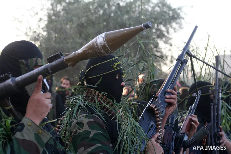 Masked Palestinian militants from Islamic Jihad take part in a training exercise as they demonstrate their skills for journalists on the outskirts of Gaza City. Tension surged in and around Gaza today as the Islamist rul...