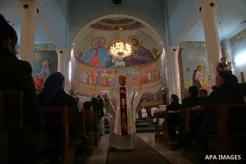 Palestinian Christians attend with his mother the Christmas at the Latin Catholic Church in Gaza City on December 24, 2008. Some 2,000 Palestinian Christians live in the Hamas-run Gaza Strip. APAIMAGES PHOTO / ASHRAF AMR...