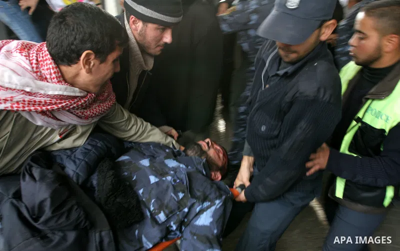 Palestinians wounded in Israeli missile strikes are seen in the emergency area at Shifa hospital in Gaza City, Saturday, Dec. 27, 2008. Israeli warplanes demolished dozens of Hamas security compounds across Gaza on Satur...