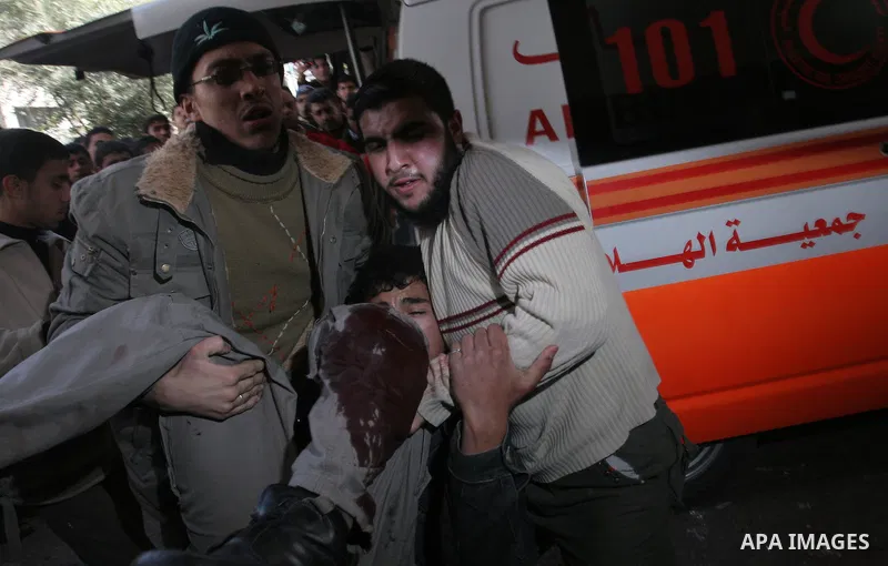 Palestinians wounded in Israeli missile strikes are seen in the emergency area at Shifa hospital in Gaza City, Saturday, Dec. 27, 2008. Israeli warplanes demolished dozens of Hamas security compounds across Gaza on Satur...