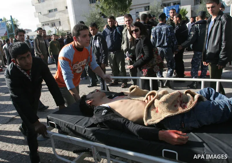 Palestinians wounded in Israeli missile strikes are seen in the emergency area at Shifa hospital in Gaza City, Saturday, Dec. 27, 2008. Israeli warplanes demolished dozens of Hamas security compounds across Gaza on Satur...