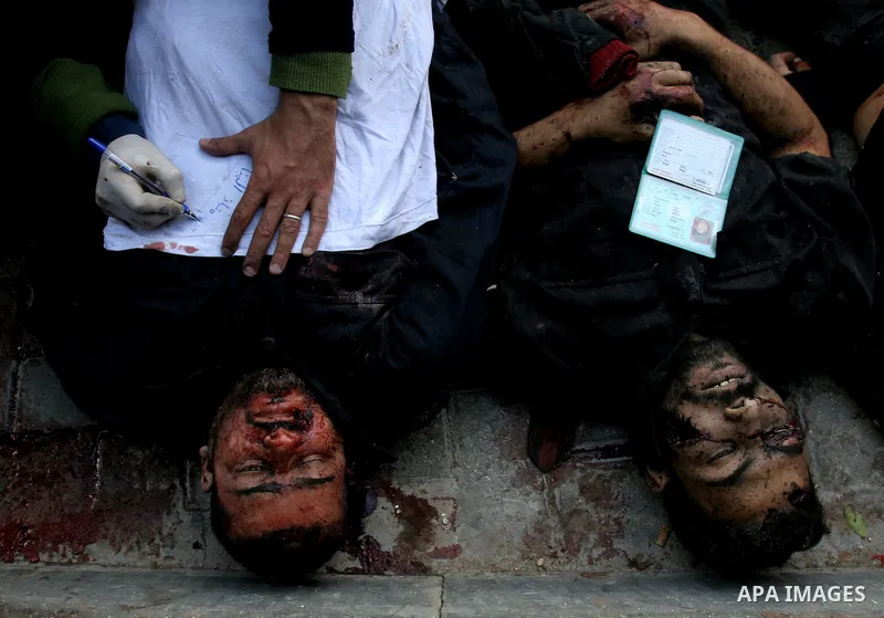 Bodies of Palestinians are seen at Shifa hospital in Gaza December 27, 2008. Israel's air force fired about 30 missiles at targets in the Gaza Strip on Saturday, destroying several Hamas police compounds and killing more...