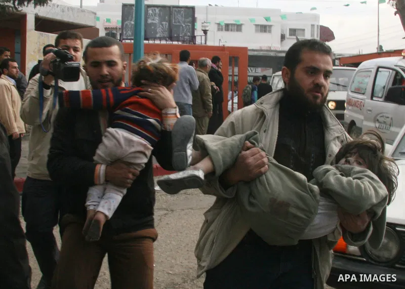 Palestinians wounded in Israeli missile strikes are seen in the emergency area at Shifa hospital in Gaza City, Saturday, Dec. 27, 2008. Israeli warplanes demolished dozens of Hamas security compounds across Gaza on Satur...