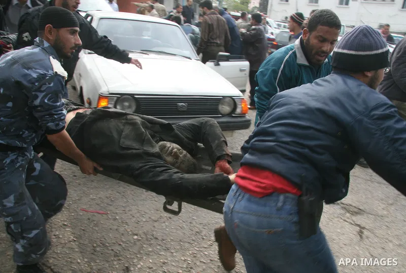 Palestinians wounded in Israeli missile strikes are seen in the emergency area at Shifa hospital in Gaza City, Saturday, Dec. 27, 2008. Israeli warplanes demolished dozens of Hamas security compounds across Gaza on Satur...