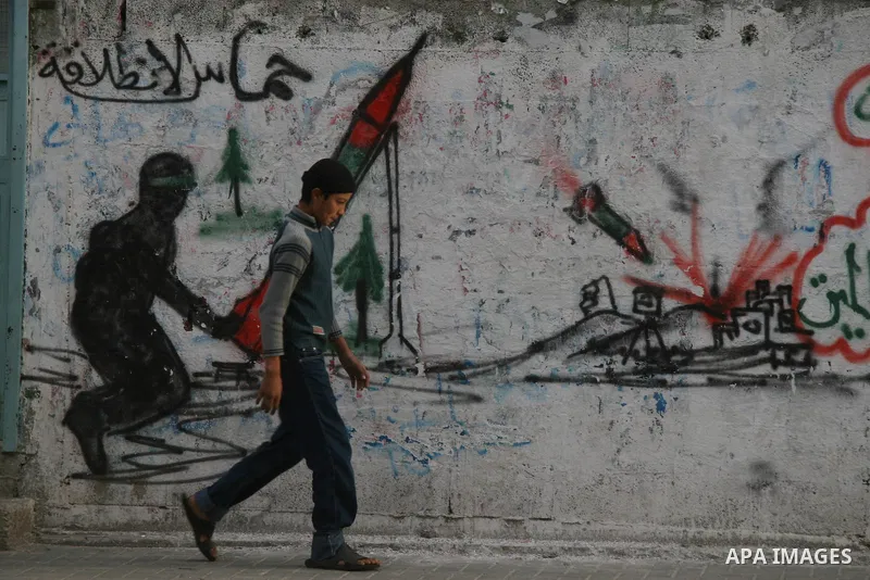 Palestinians look at destroyed buildings after an explosion from an Israeli missile strike in Gaza City. Israeli warplanes pounded the Hamas-ruled Gaza Strip for a third consecutive day on Monday and the Jewish state pre...