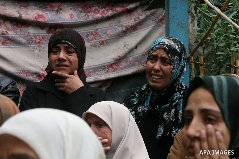 Palestinian relatives of 4-year-old girl, Haya Hamdan, killed with her sister, Lama, 12, in an Israeli missile strike, mourn during her funeral in town of Beit Hanoun, northern Gaza Strip, Tuesday, Dec. 30, 2008. Israeli...