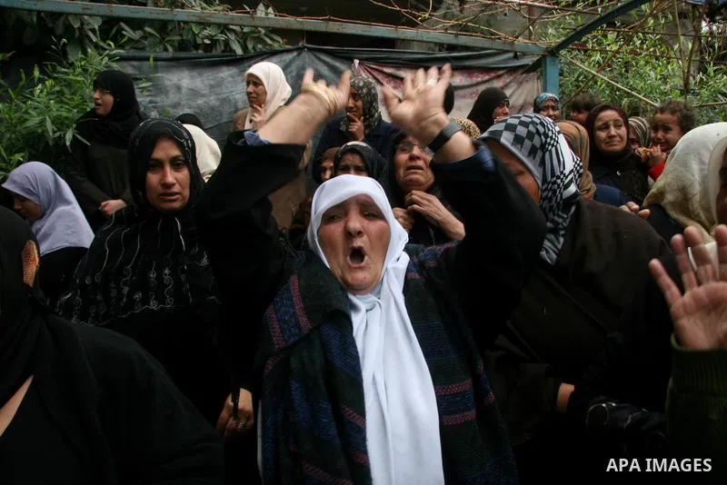 Palestinian relatives of 4-year-old girl, Haya Hamdan, killed with her sister, Lama, 12, in an Israeli missile strike, mourn during her funeral in town of Beit Hanoun, northern Gaza Strip, Tuesday, Dec. 30, 2008. Israeli...