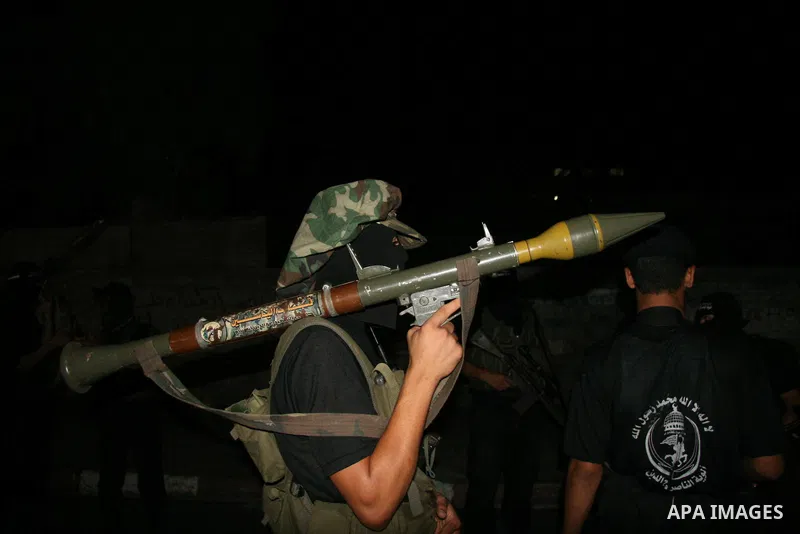 Palestinian militants of the Nasser Salah al-Din Brigades military wing of the Popular Resistance Committees take part in an annual march to mark the creation of their group in Gaza City.