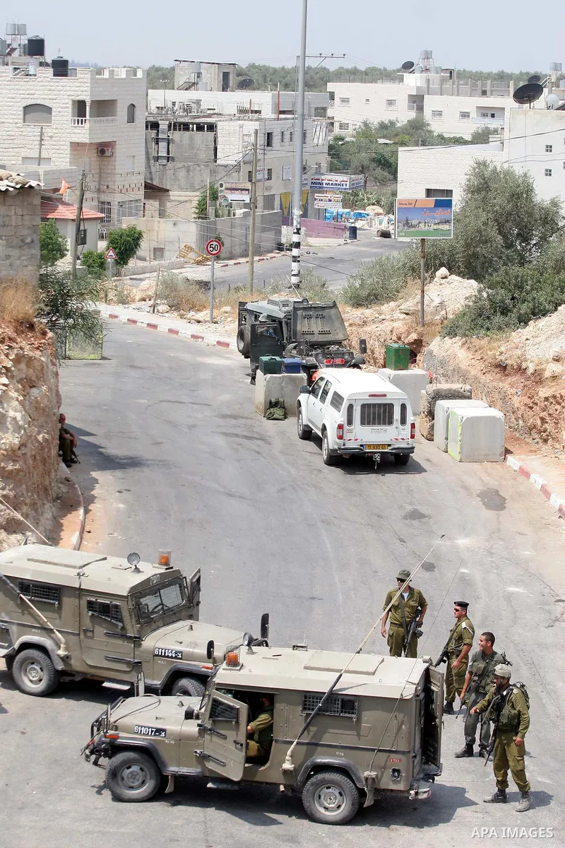 Israeli army impose a curfew on the West Bank village of Bilin, near Ramallah. Palestinian, Israeli, and international activists have held weekly protests for more than two years in Bilin against the Israel's constructio...