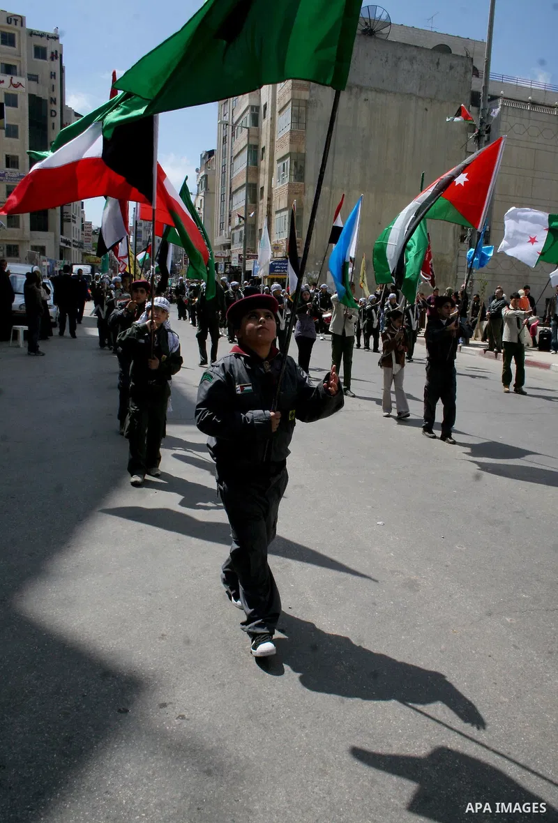 Palestinians take part in a traditional parade in the streets of the West Bank city of Ramallah on March 21, 2009 to celebrate Jerusalem's designation as the 2009 'capital of Arab culture'. Celebrations in the West Bank...