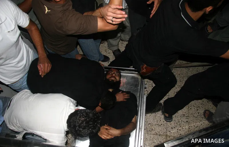 Palestinians mourn over the body of a Palestinian victim killed in an explosion, at Shifa hospital morgue in Gaza City. Hamas-run security forces fanned out across Gaza City today, clashing with rival gunmen and arrestin...