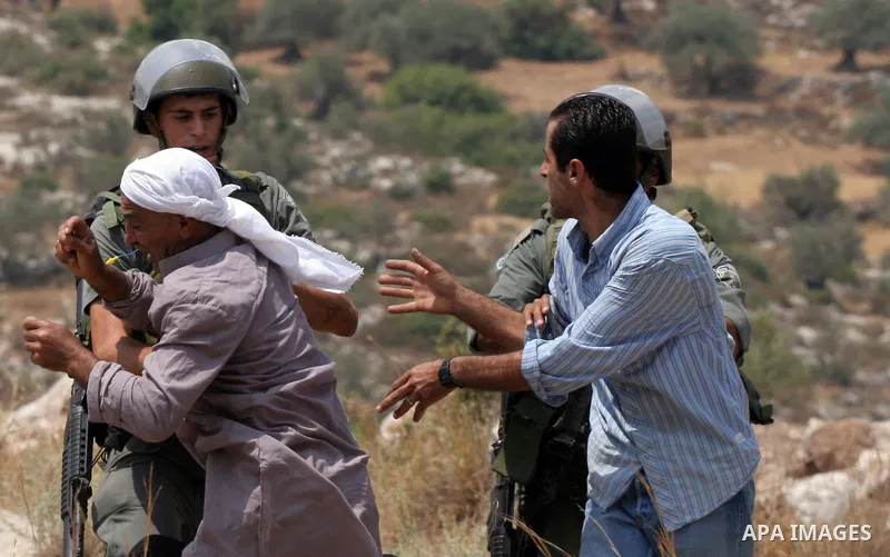 Israeli soldiers scuffle with Palestinian and international protestors during a demonstration against the construction of the controversial Israeli cement barrier in the West Bank village of Nilin near Ramallah. Sixteen...