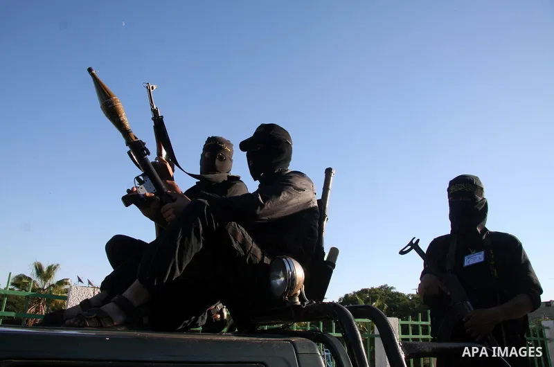 Masked Palestinian members of the military wing of Islamic Jihad Brigades Jerusalem, "Jerusalem Brigades", participate in a rally for the Islamic Jihad in the northern Gaza Strip.