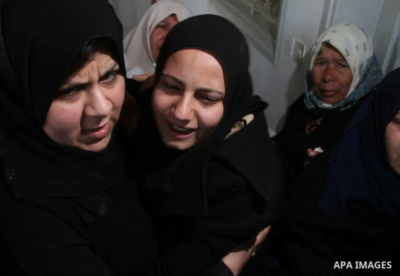 Palestinian relatives of Rami Kraym, a militant of the Military Wing of the Popular Front for Liberation Palestine "Abu Ali Mustafa Brigades" , mourn during his funeral in Gaza City. Kraym was killed during a fire exchan...