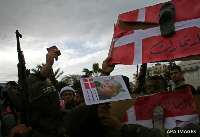 Palestinians take part in a rally in Gaza. The rally, organised by popular resistant committees, was a protest against a cartoon of Prophet Mohammad that was republished by Danish newspapers on February 13. The reprinted...