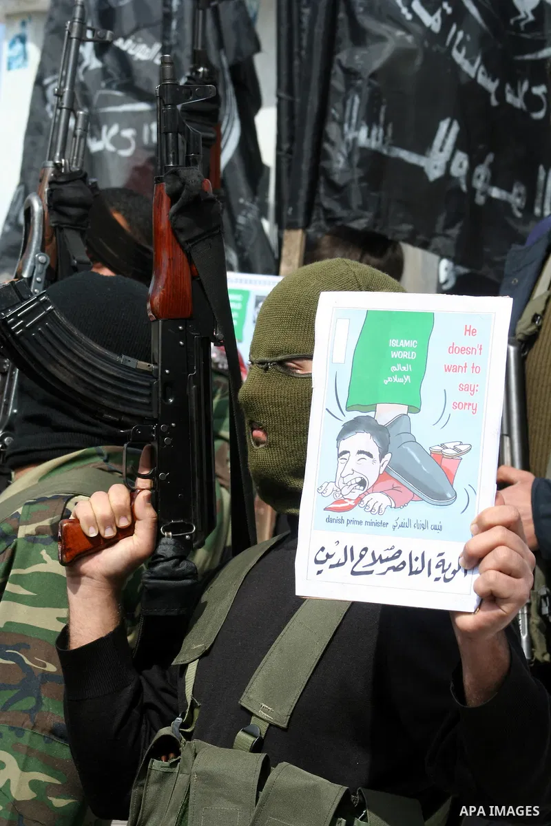 Palestinians take part in a rally in Gaza. The rally, organised by popular resistant committees, was a protest against a cartoon of Prophet Mohammad that was republished by Danish newspapers on February 13. The reprinted...