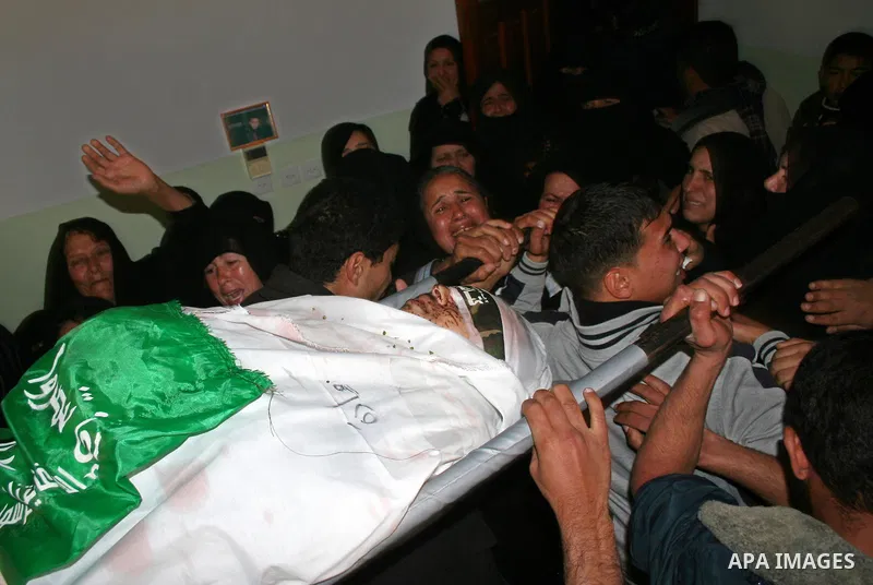 Palestinian Relatives of Hamas militant Mohammed Abu Sadah, carry his body during his funeral in the southern Gaza Strip. Israeli forces killed nine Hamas militants in the Gaza Strip on Tuesday and the Islamist group's a...
