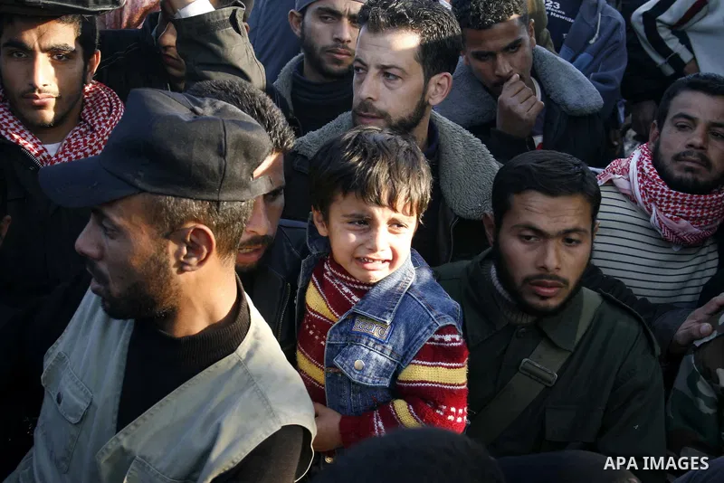Palestinians who was stuck at Egypt as they wait to cross into Gaza at Rafah's border crossing, southern Gaza Strip. Egypt has warned Palestinians against trying to break through its resealed Gaza border about two weeks...