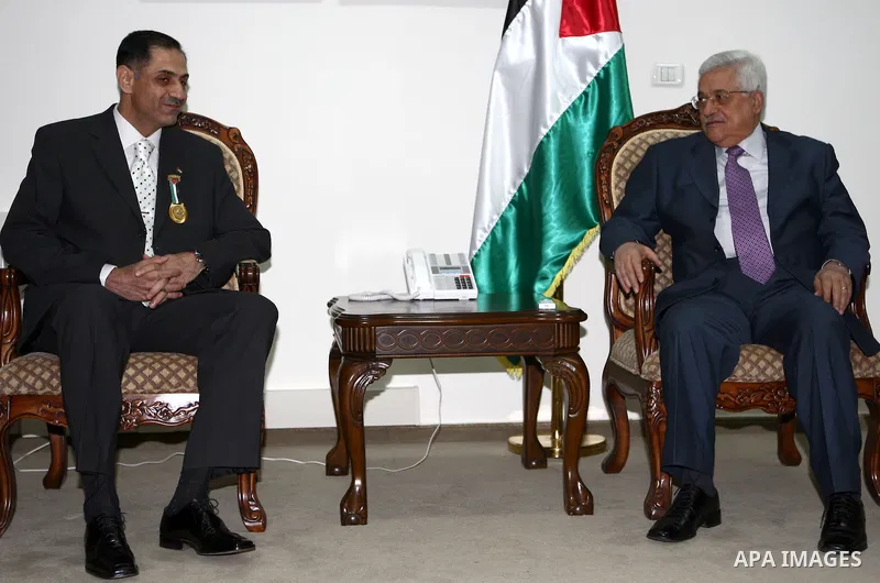 Palestinian President Mahmoud Abbas is granted Major General Mohamed Madhar the Jerusalem's Medallion, in the West Bank city of Ramallah.