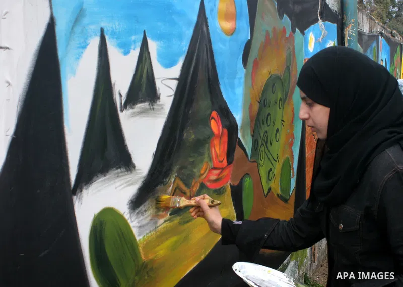 Palestinian artists paint a murals reflect the suffering of Palestinian people due to The Israeli siege imposed on Gaza Strip, in Gaza City. Human rights organizations organized artistical activities to reflect the suffe...