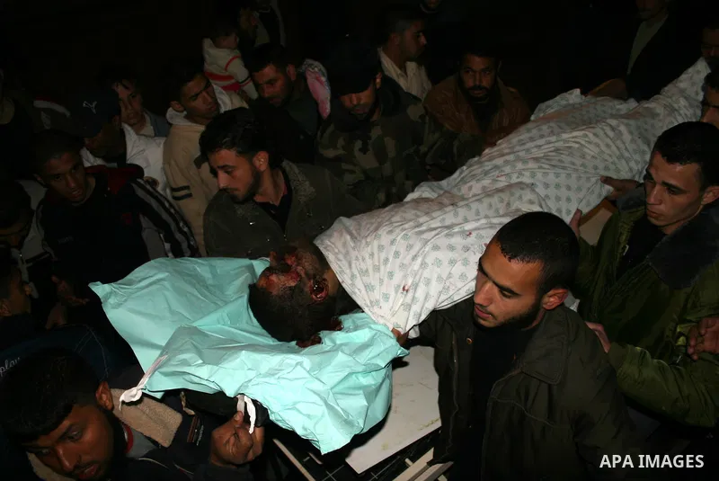 Palestinians carry the body of one of three Islamic Jihad militants killed in Israeli airstrikes to the morgue of al-Shifa hospital in Gaza City. Israeli aircraft killed three members of Islamic Jihad who were preparing...