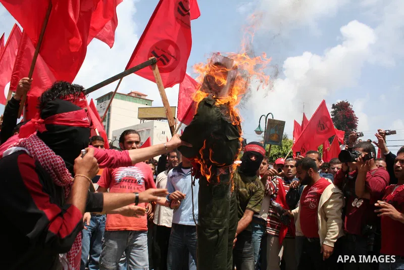 Palestinians burn an effigy of Israel's Defence Minister Ehud Barak during a protest against the lack of employment opportunities in Gaza City April 30, 2009, a day before World Labour Day APAIMAGES PHOTO / Ashraf Amra