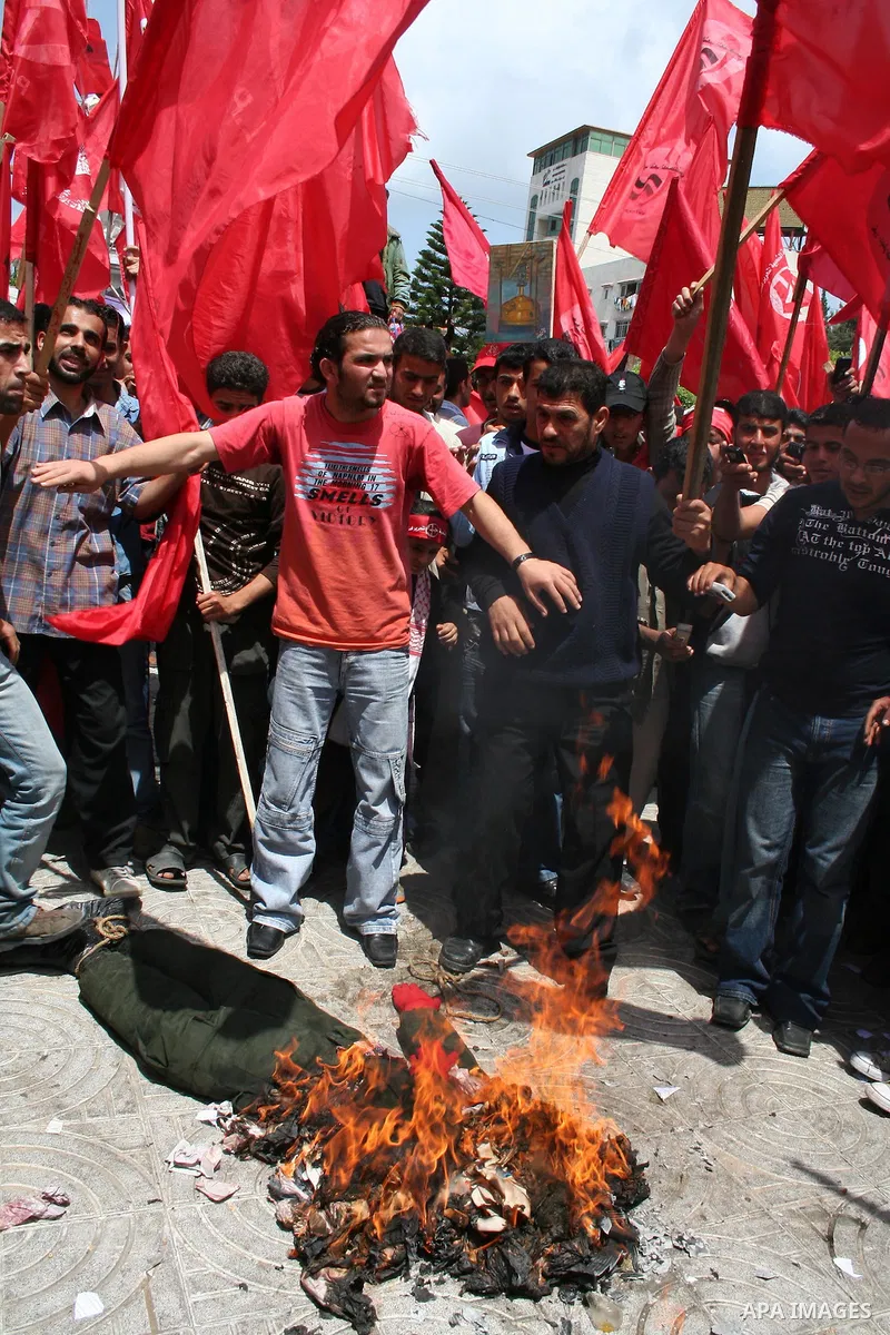 Palestinians burn an effigy of Israel's Defence Minister Ehud Barak during a protest against the lack of employment opportunities in Gaza City April 30, 2009, a day before World Labour Day APAIMAGES PHOTO / Ashraf Amra