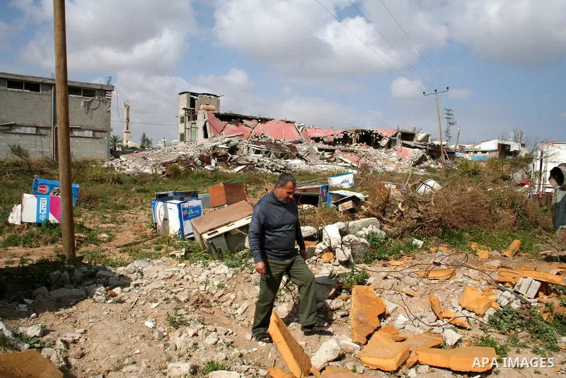 A Palestinian man walks on the rubble of his factory which was destroyed during the Gaza war in Jabalia in the northern Gaza Strip on April 30, 2009, a day before World Labour Day (May Day) APAIMAGES PHOTO / Ashraf Amra