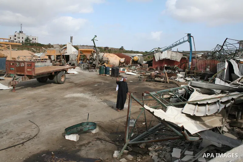 A Palestinian man walks on the rubble of his factory which was destroyed during the Gaza war in Jabalia in the northern Gaza Strip on April 30, 2009, a day before World Labour Day (May Day) APAIMAGES PHOTO / Ashraf Amra