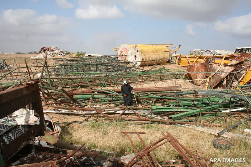A Palestinian man walks on the rubble of his factory which was destroyed during the Gaza war in Jabalia in the northern Gaza Strip on April 30, 2009, a day before World Labour Day (May Day) APAIMAGES PHOTO / Ashraf Amra