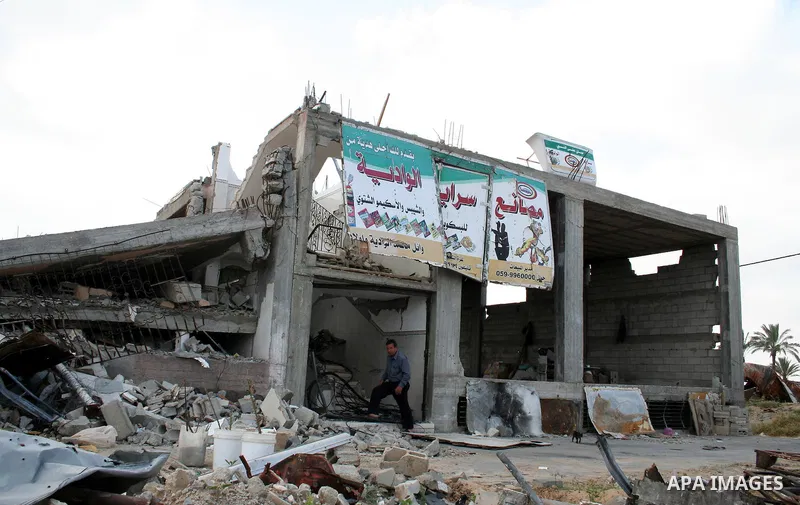 A Palestinian man walks on the rubble of his factory which was destroyed during the Gaza war in Jabalia in the northern Gaza Strip on April 30, 2009, a day before World Labour Day (May Day) APAIMAGES PHOTO / Ashraf Amra